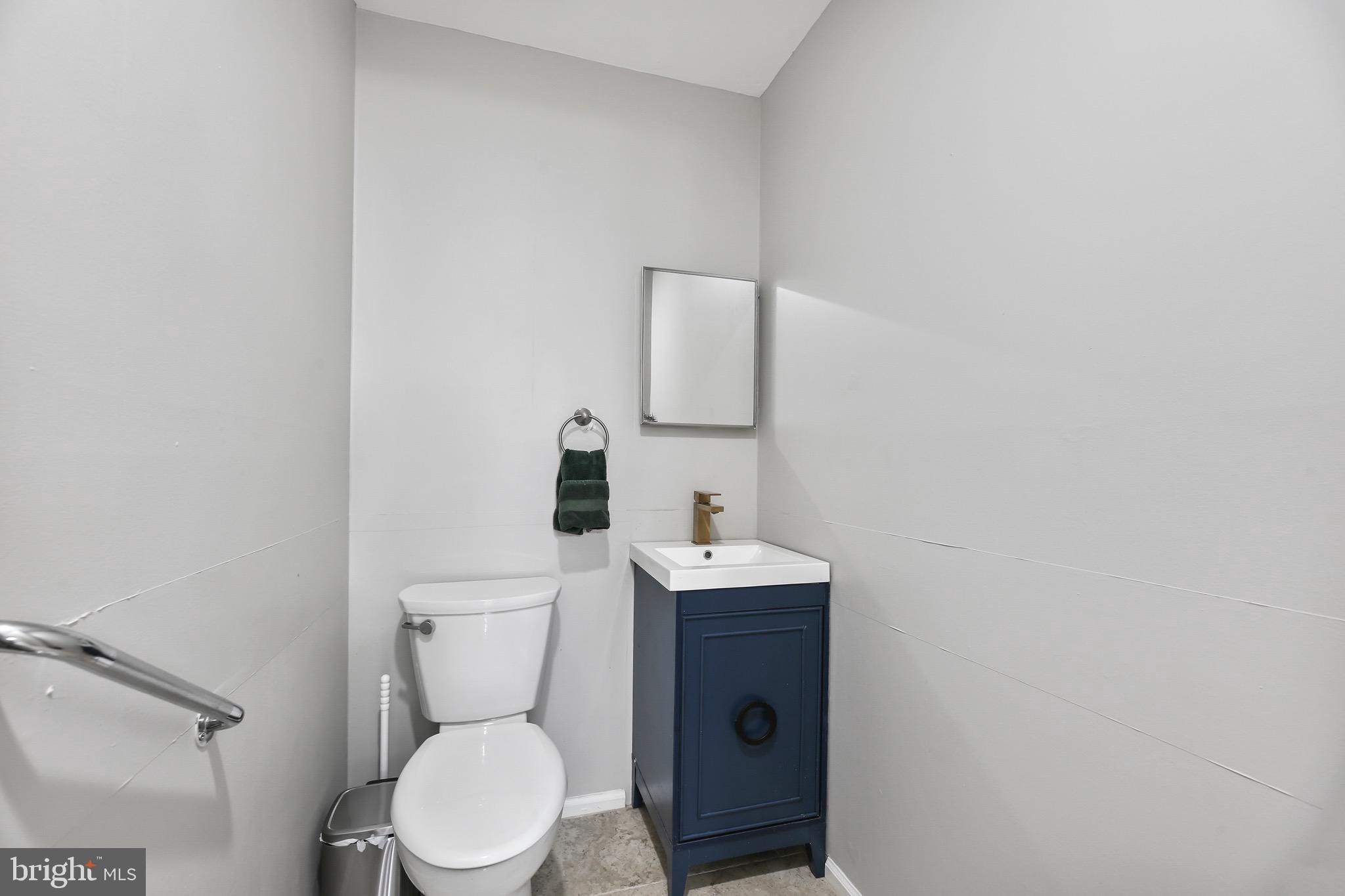 6218 Lindbergh Blvd. Philadelphia, PA 19142 - Photo 6 of 17 a white toilet sitting next to a bathroom sink