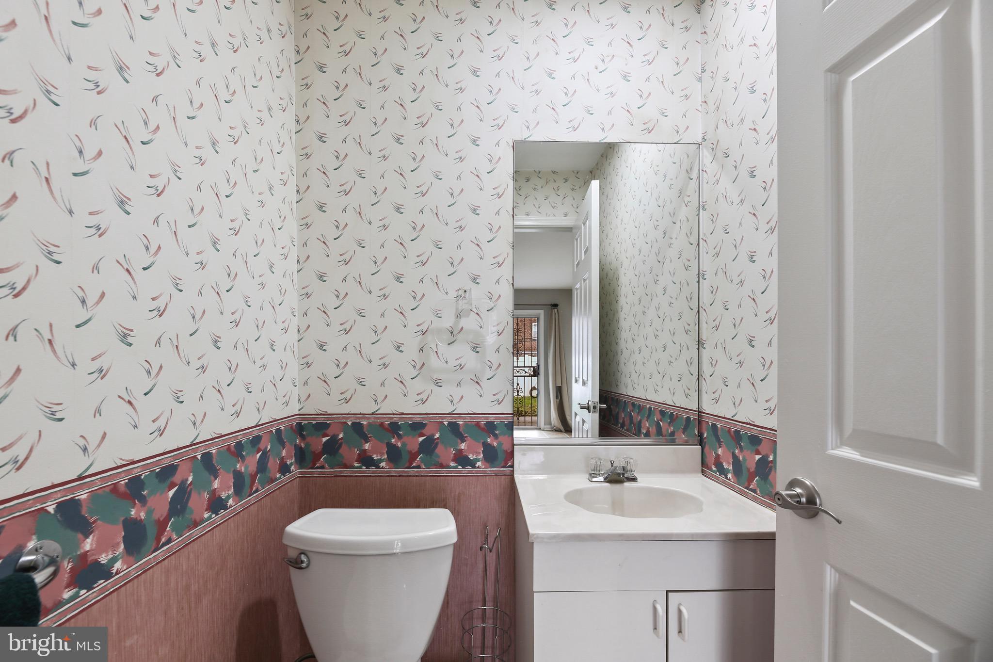 6218 Lindbergh Blvd. Philadelphia, PA 19142 - Photo 9 of 17 a bathroom with a toilet sink and mirror