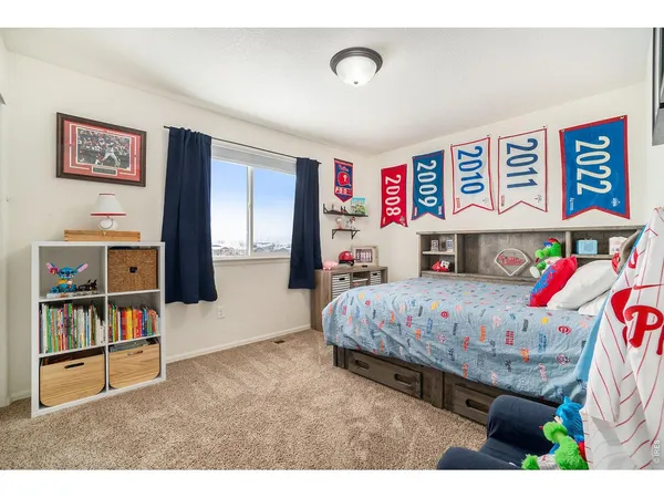 a bedroom with a bed and dresser