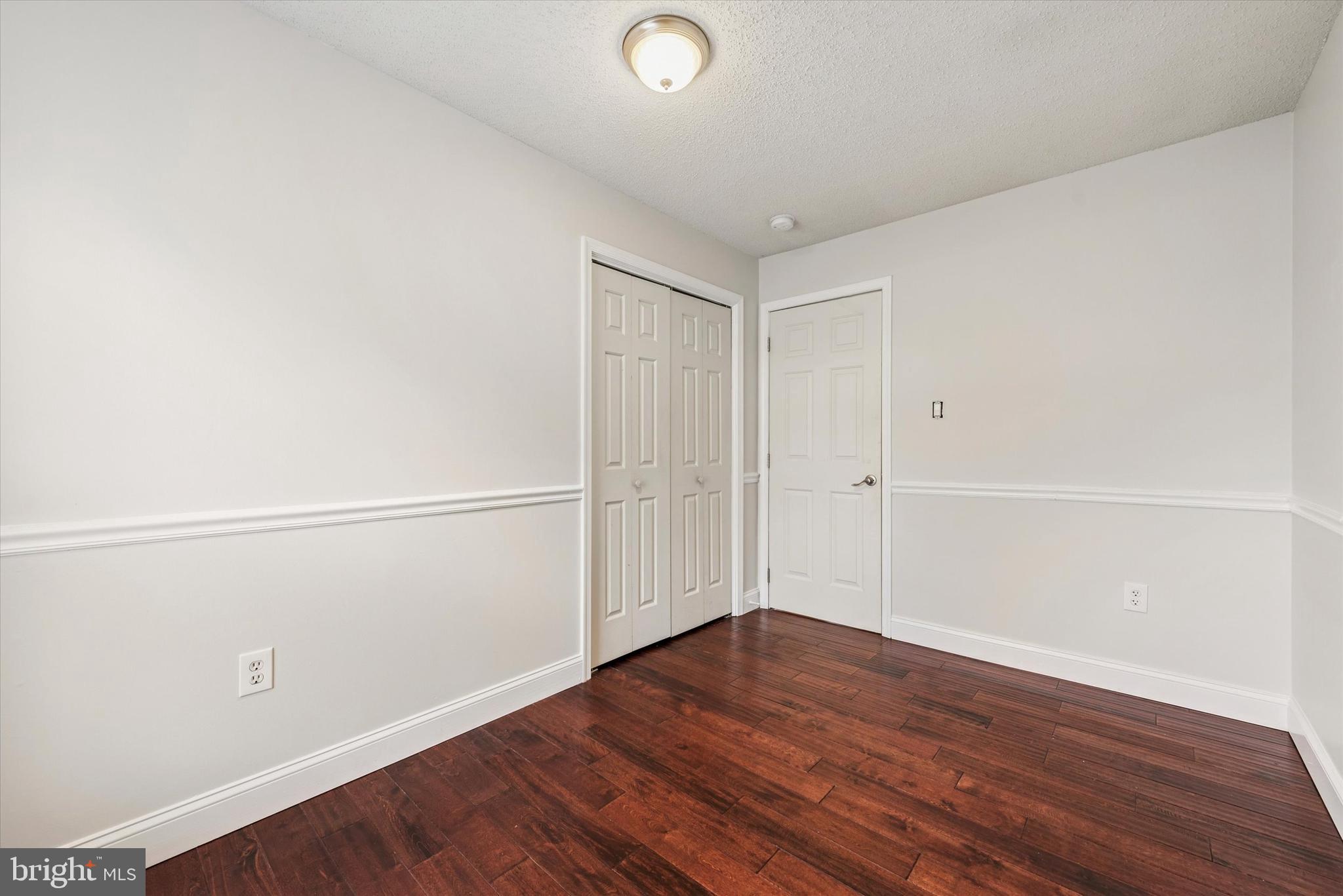 1430 South Bailey Road Coatesville, PA 19320 - Photo 12 of 37 an empty room with wooden floor
