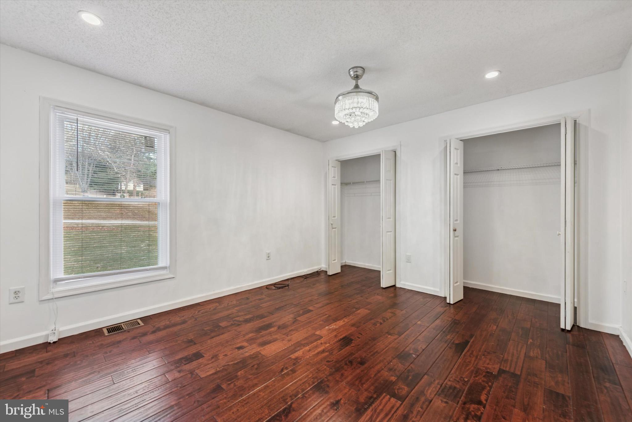 1430 South Bailey Road Coatesville, PA 19320 - Photo 14 of 37 a view of an empty room with wooden floor and a window