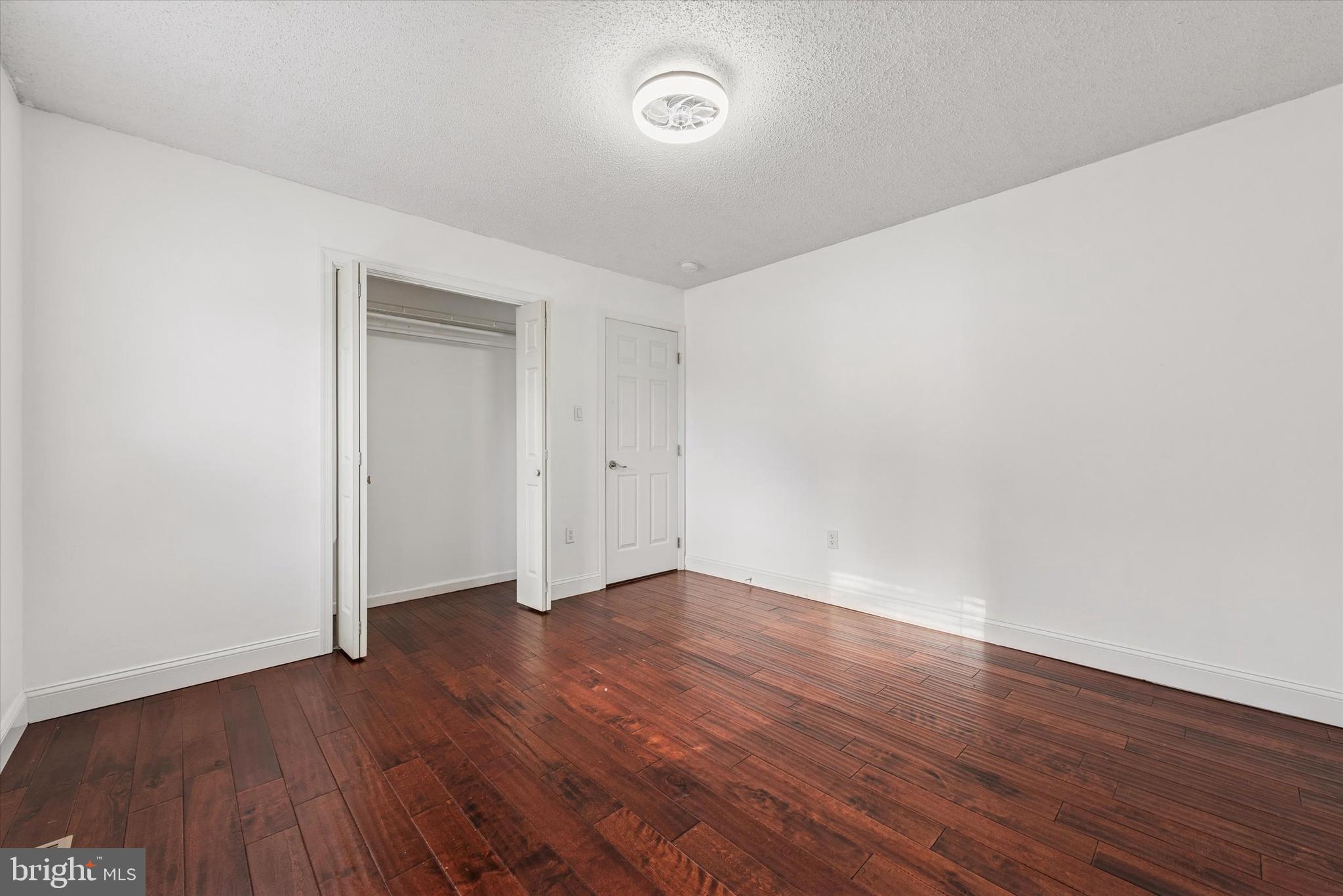 1430 South Bailey Road Coatesville, PA 19320 - Photo 15 of 37 a view of an empty room with wooden floor