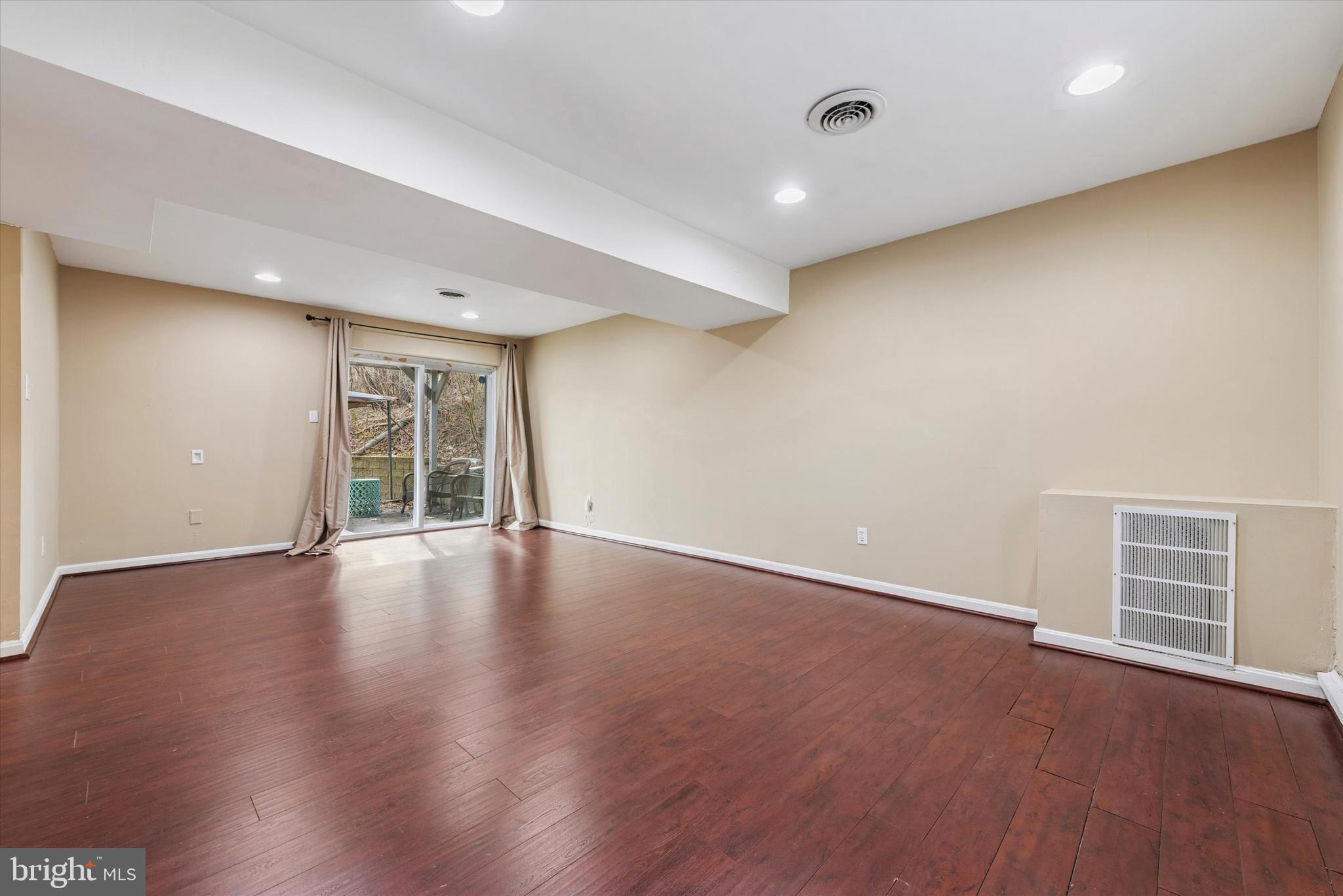 1430 South Bailey Road Coatesville, PA 19320 - Photo 19 of 37 a view of an empty room with wooden floor and a window