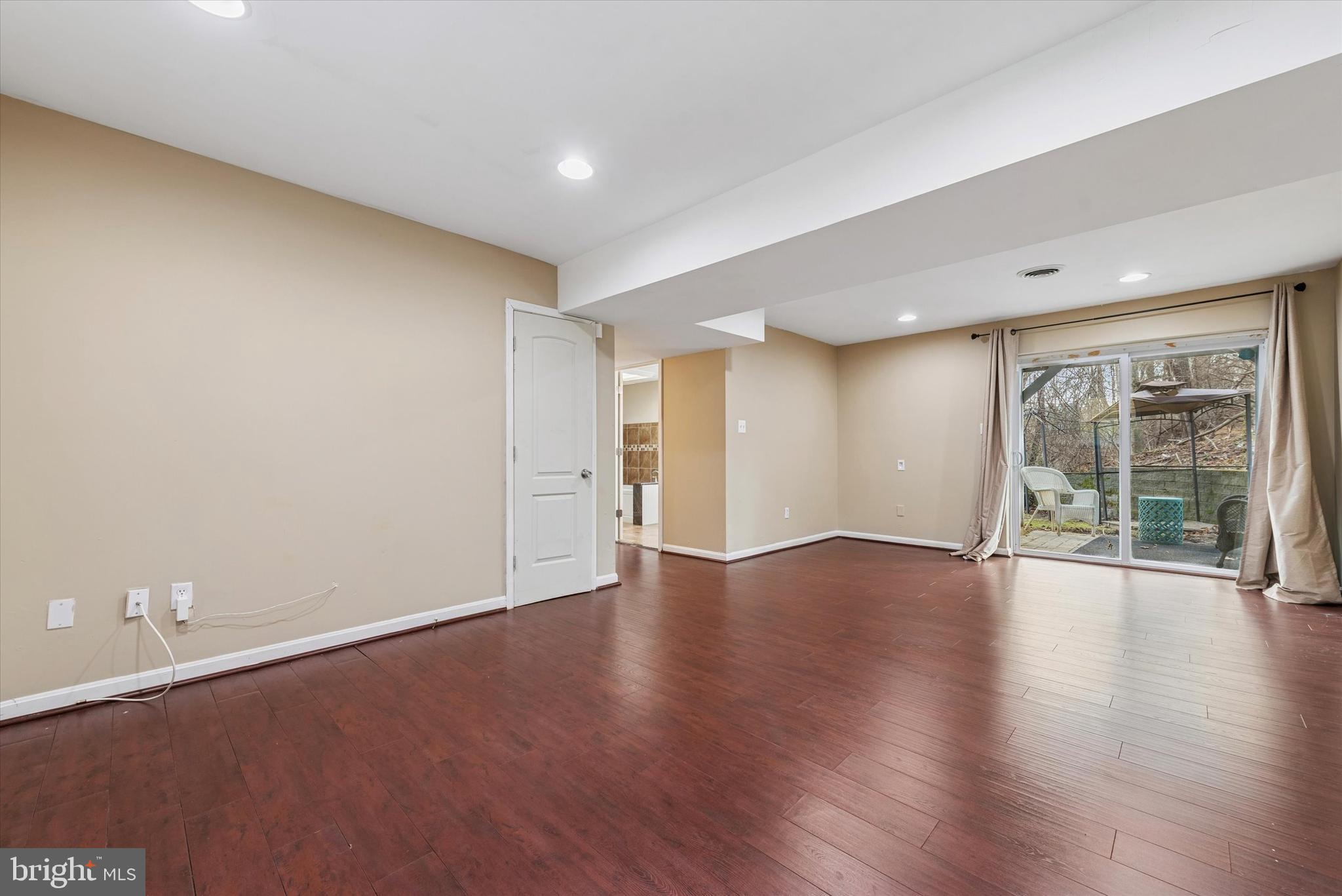 1430 South Bailey Road Coatesville, PA 19320 - Photo 20 of 37 a view of an empty room with wooden floor and a window
