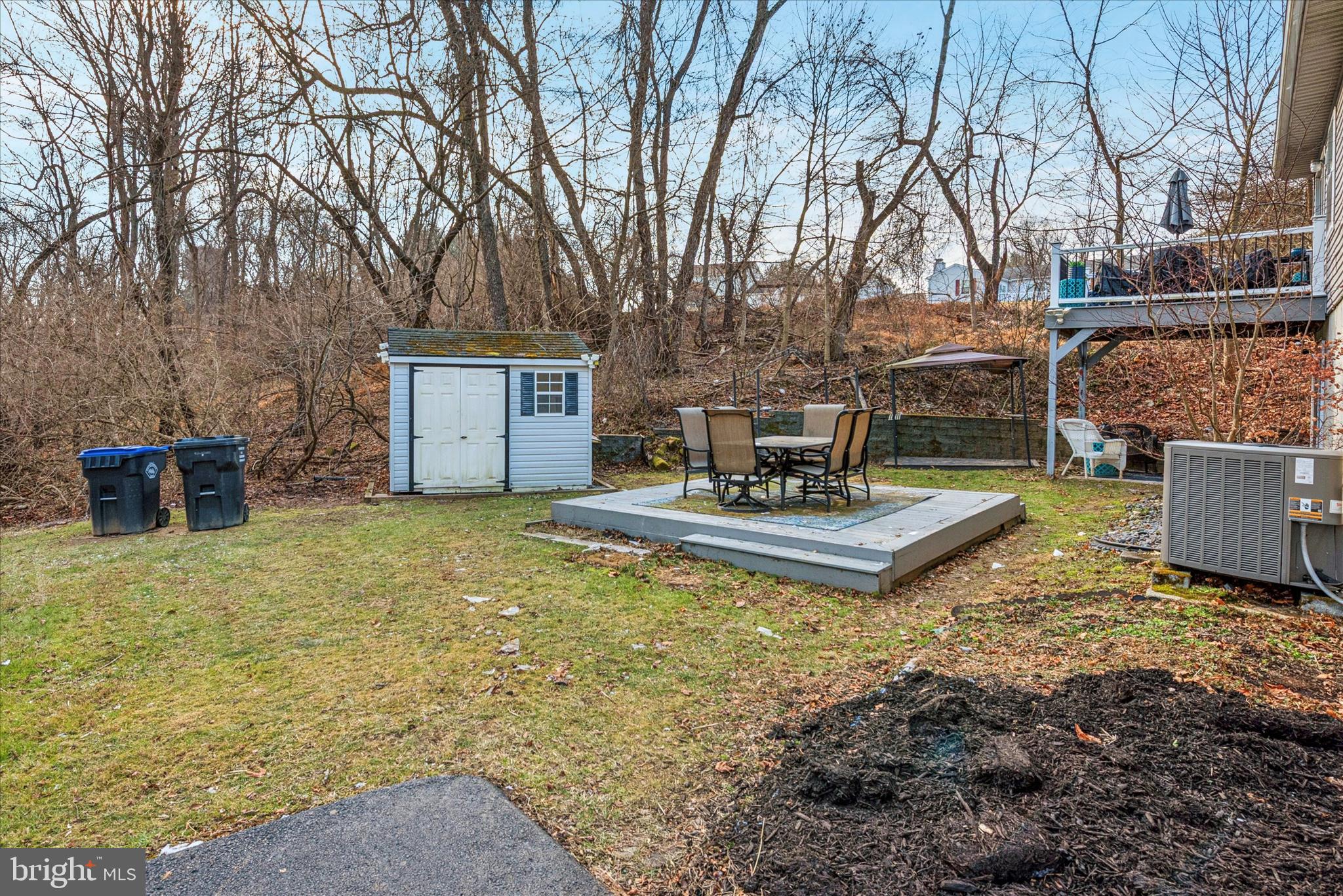 1430 South Bailey Road Coatesville, PA 19320 - Photo 31 of 37 a view of a patio with table and chairs potted plants and large tree