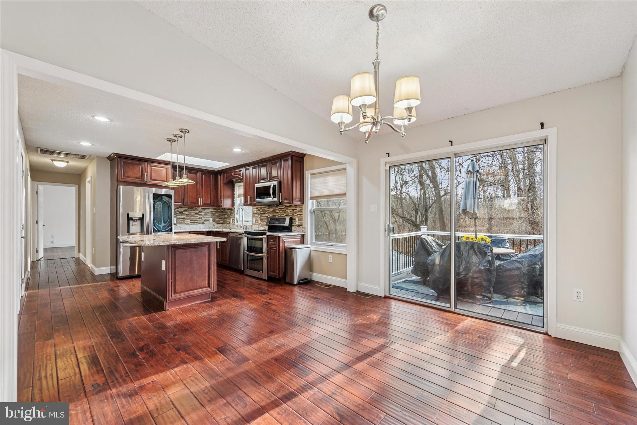 1430 South Bailey Road Coatesville, PA 19320 - Photo 4 of 37 a large kitchen with stainless steel appliances granite countertop a refrigerator a oven a large island with the view of cabinets