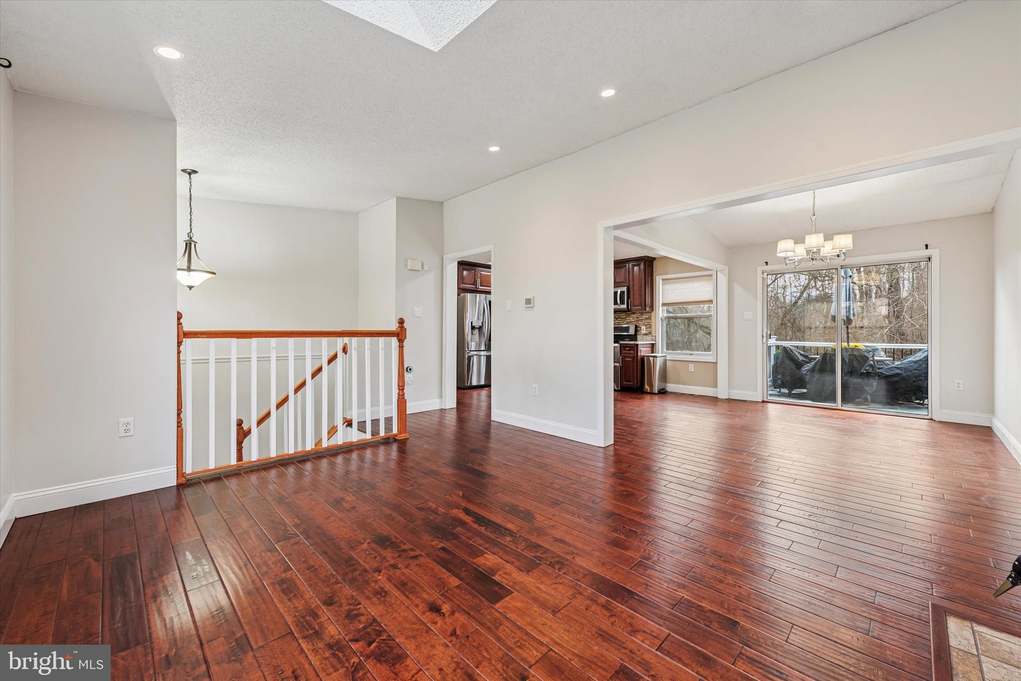1430 South Bailey Road Coatesville, PA 19320 - Photo 6 of 37 a view of an empty room with wooden floor and a floor to ceiling window