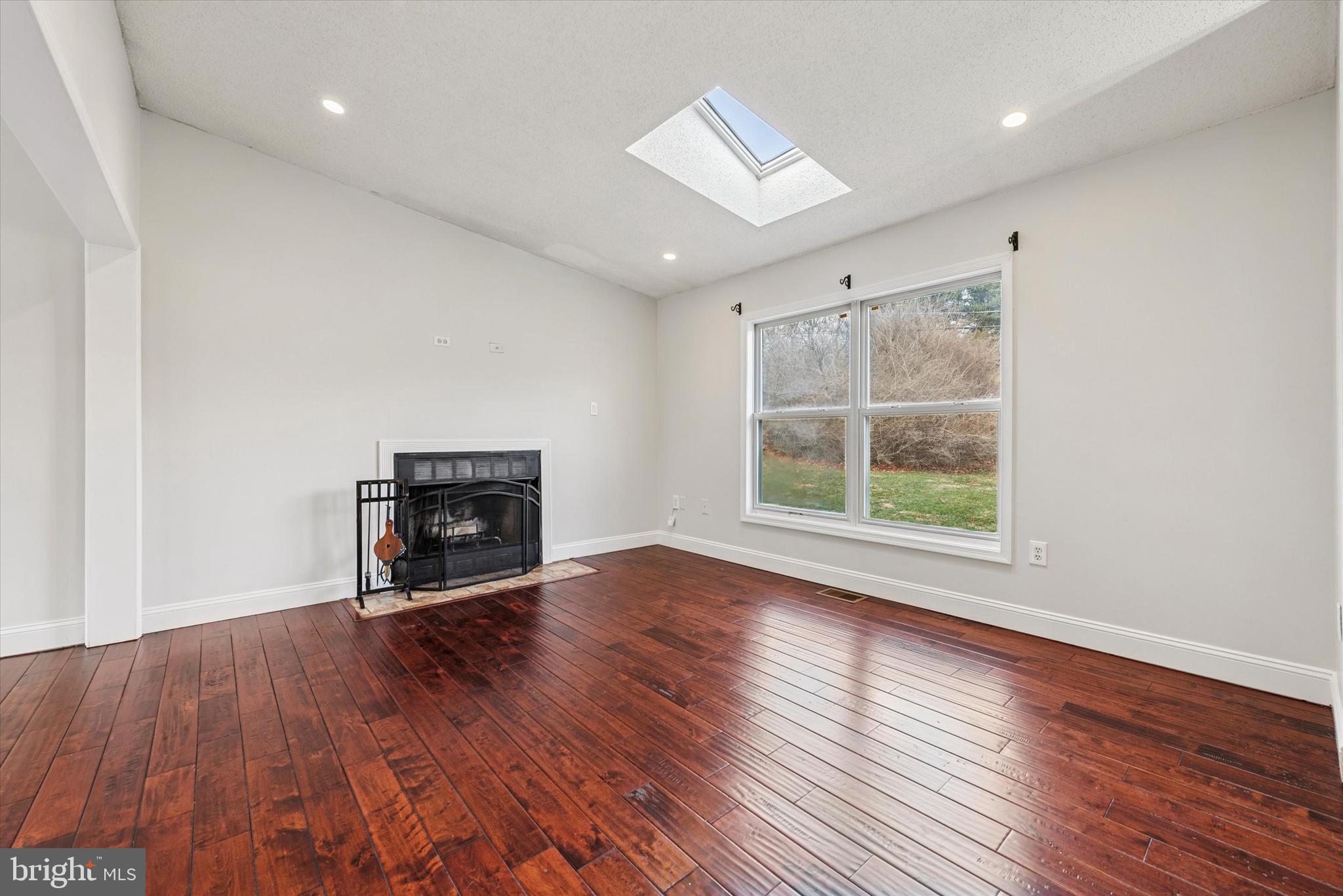 1430 South Bailey Road Coatesville, PA 19320 - Photo 7 of 37 wooden floor in an empty room with a window