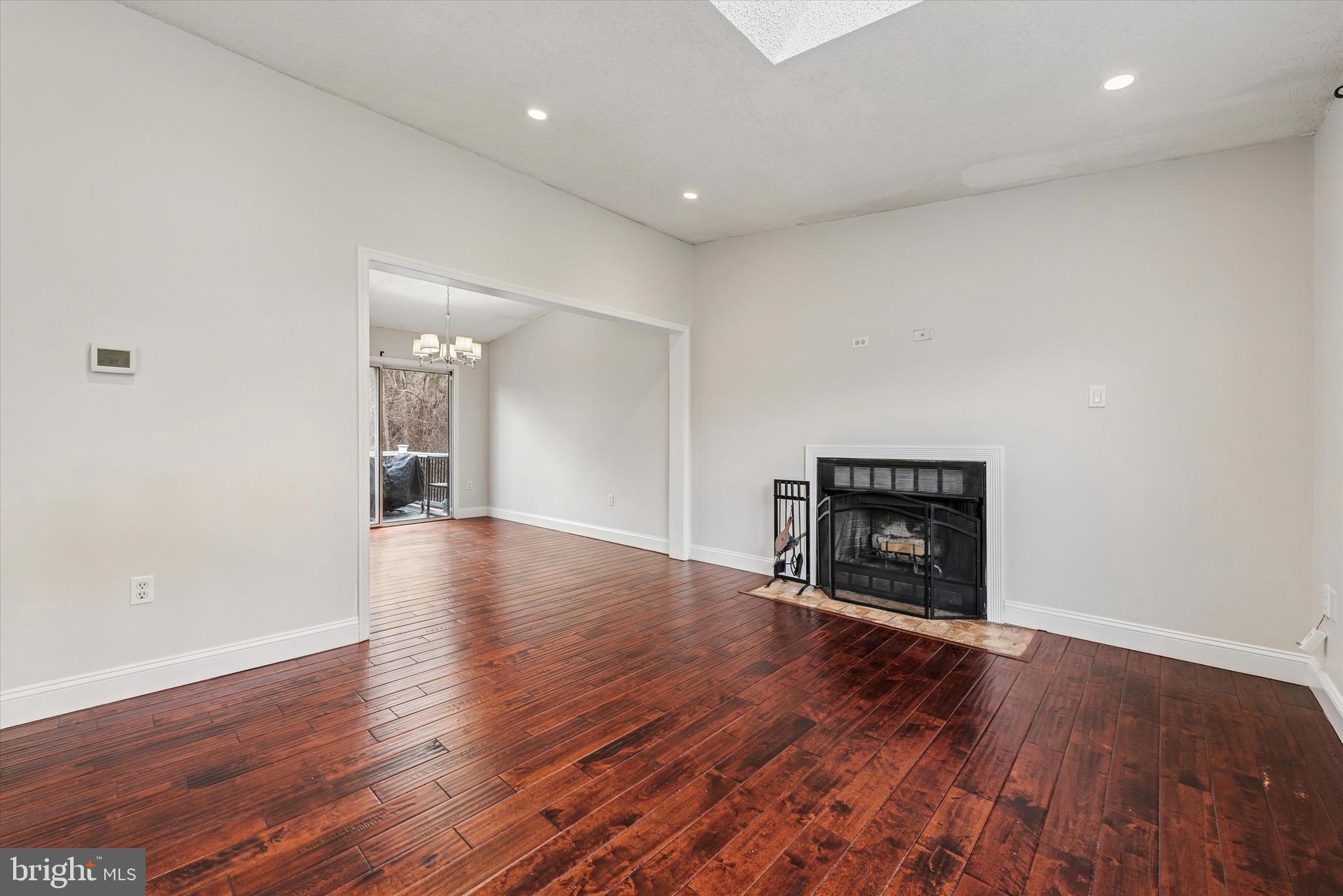 1430 South Bailey Road Coatesville, PA 19320 - Photo 8 of 37 a view of a livingroom with wooden floor and a fireplace