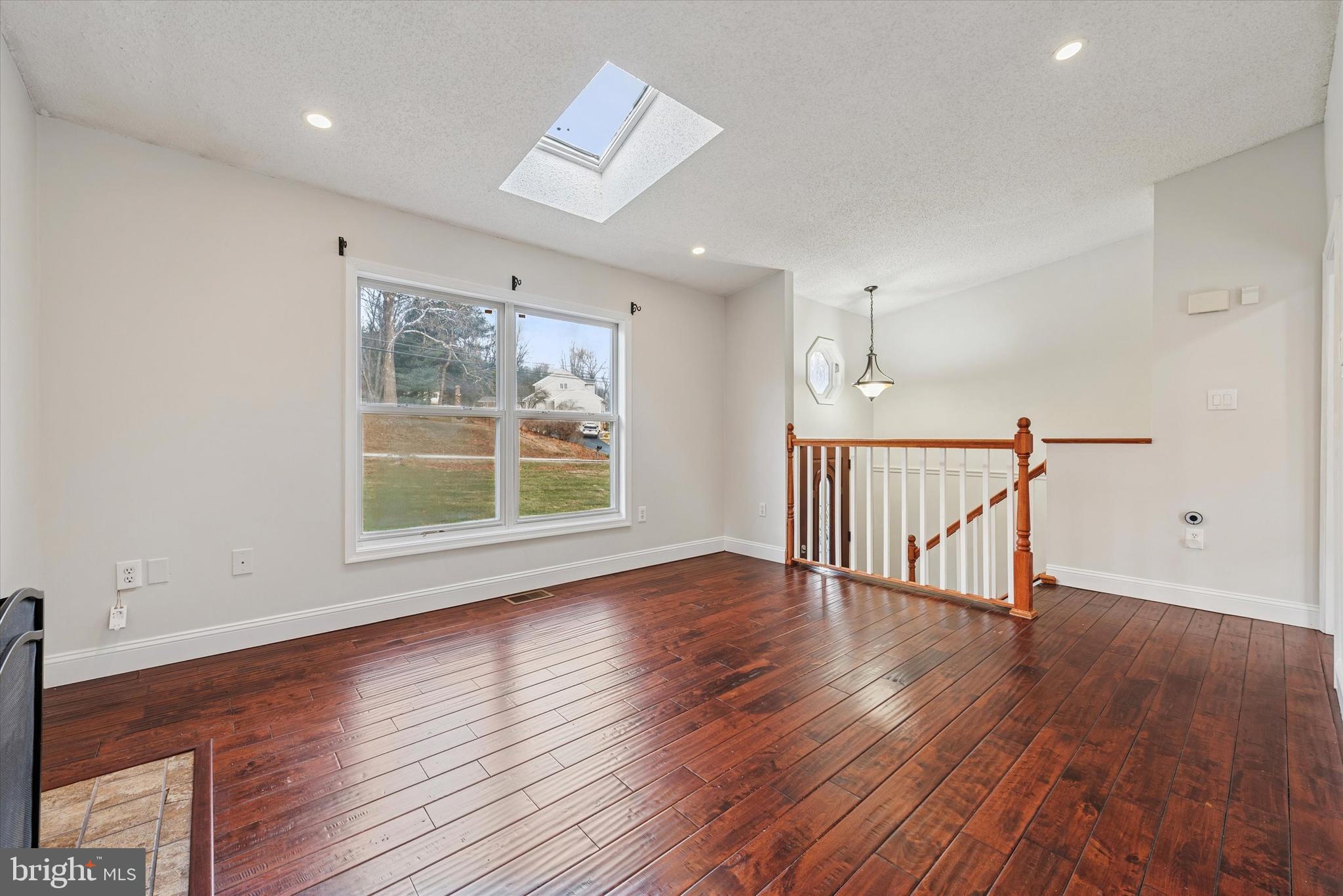 1430 South Bailey Road Coatesville, PA 19320 - Photo 9 of 37 a view of empty room with wooden floor and fan