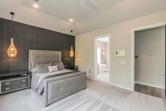 a room with a bed and a view of bathroom