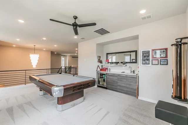 a room with furniture and a ceiling fan