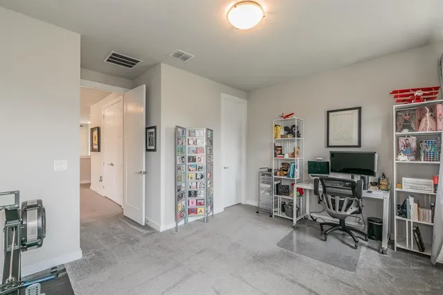 a view of a workspace with furniture
