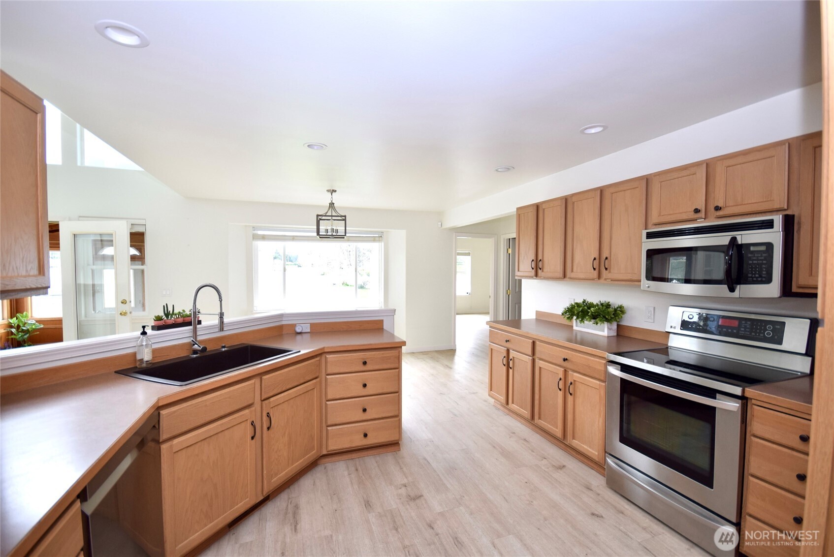 71 John Carl Road Sequim, WA 98382 - Photo 12 of 37 a kitchen with stainless steel appliances a stove sink and microwave