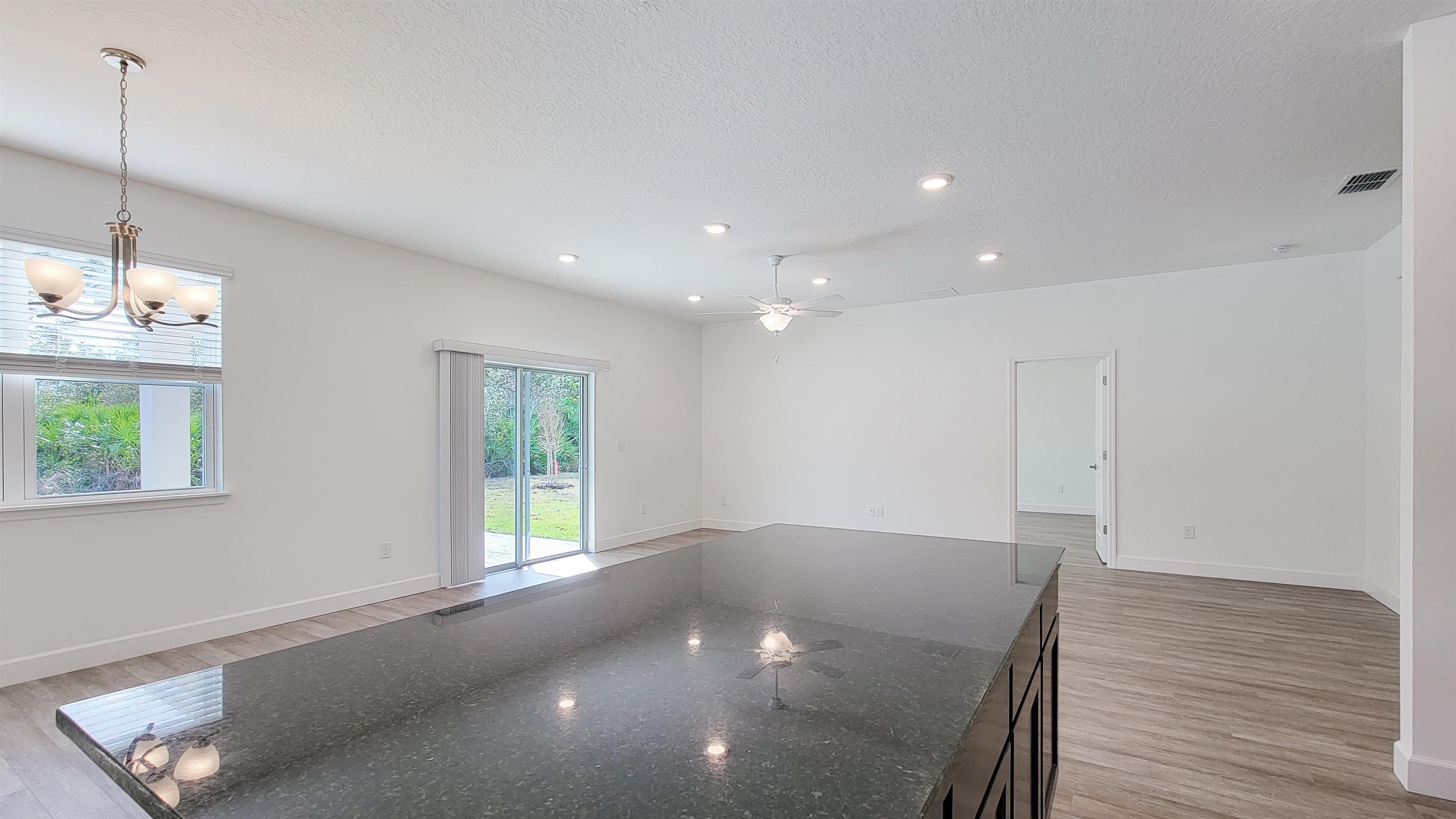 62 Roxboro Drive Palm Coast, FL 32164 - Photo 14 of 35 a view of a room with window and wooden floor