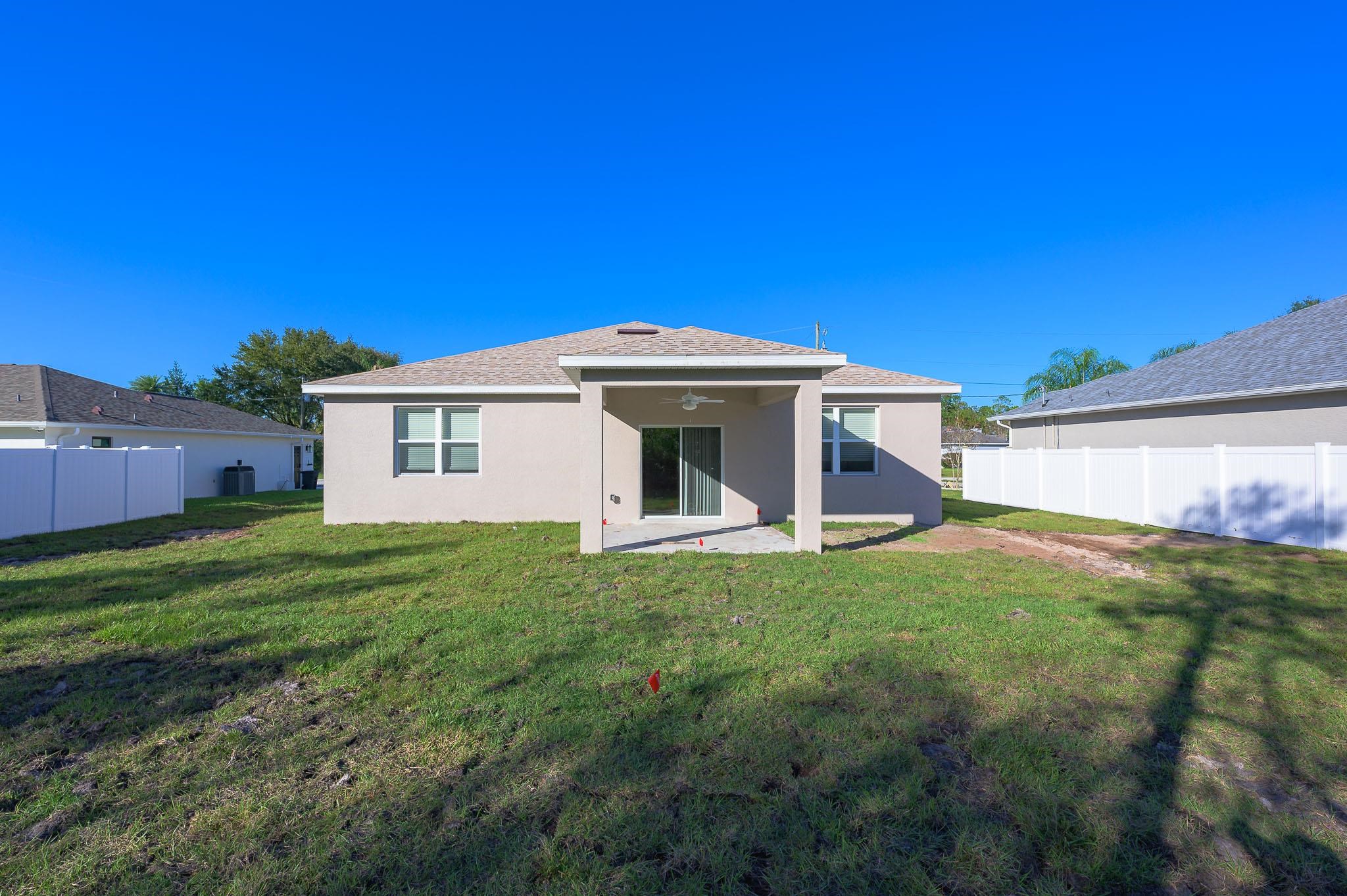 62 Roxboro Drive Palm Coast, FL 32164 - Photo 28 of 35 a view of a house with a backyard