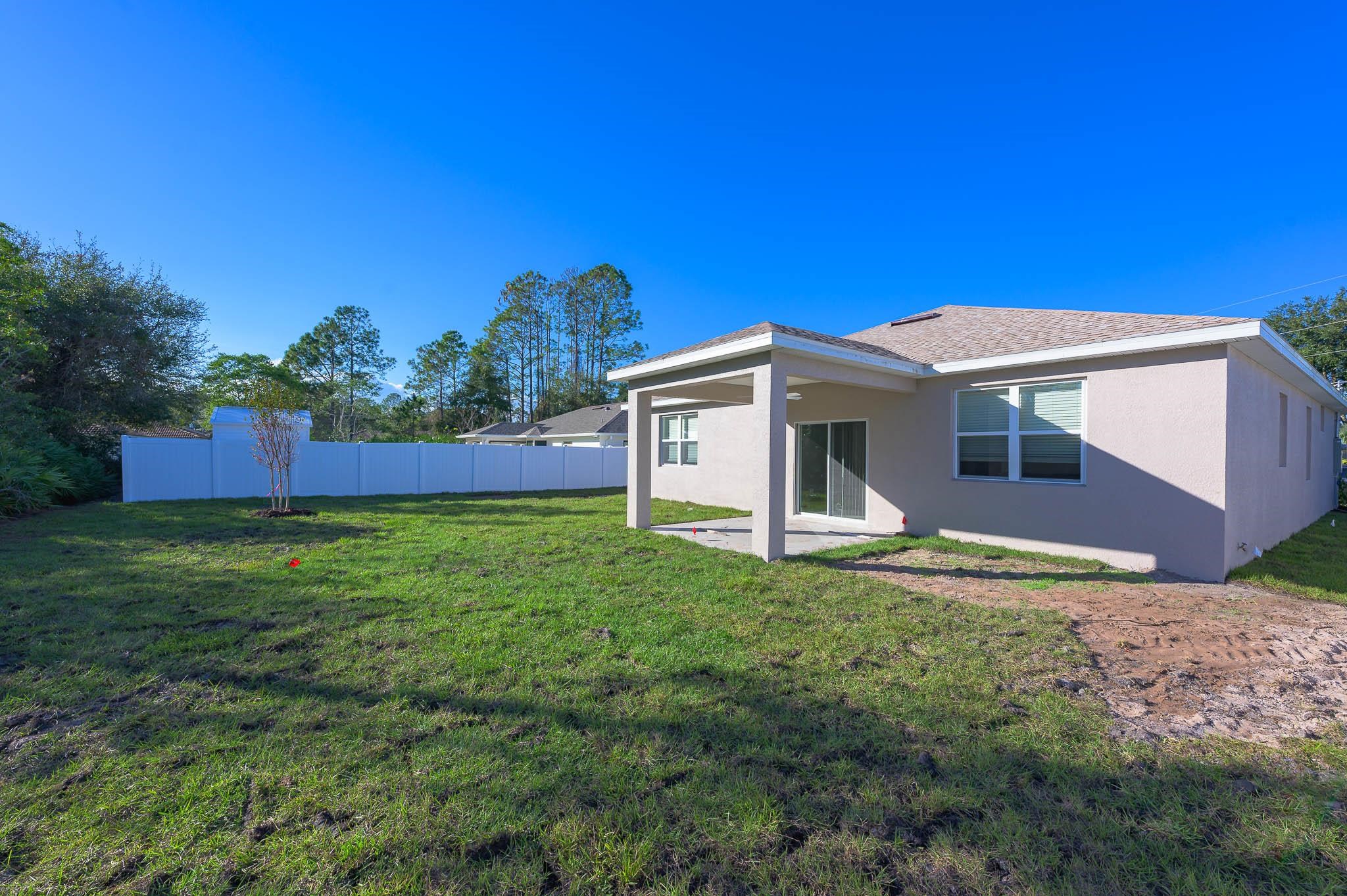 62 Roxboro Drive Palm Coast, FL 32164 - Photo 29 of 35 a view of a house with a backyard