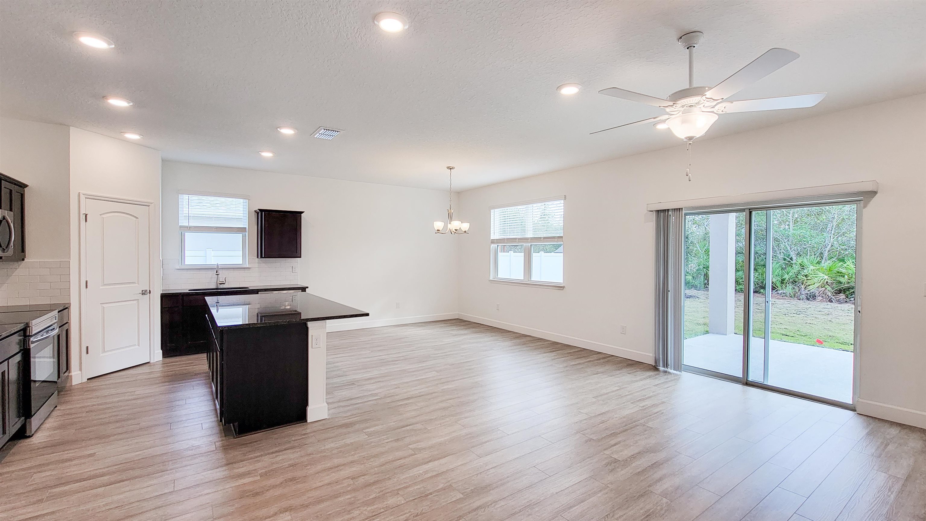 62 Roxboro Drive Palm Coast, FL 32164 - Photo 10 of 35 a view of kitchen with sink and wooden floor
