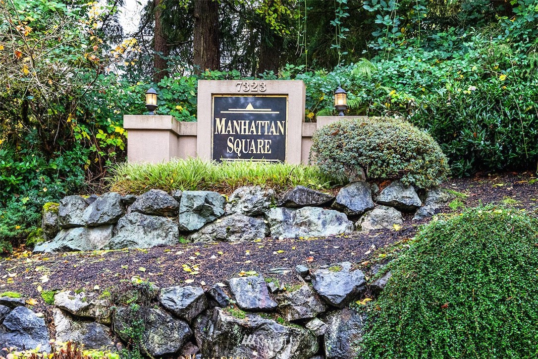 7323 Old Redmond Road, Unit 6 Redmond, WA 98052 - Photo 18 of 18 a sign that is sitting in front of flowers
