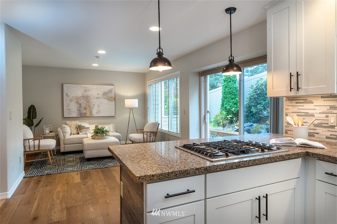7323 Old Redmond Road, Unit 6 Redmond, WA 98052 - Photo 7 of 18 a living room with large window and chandelier