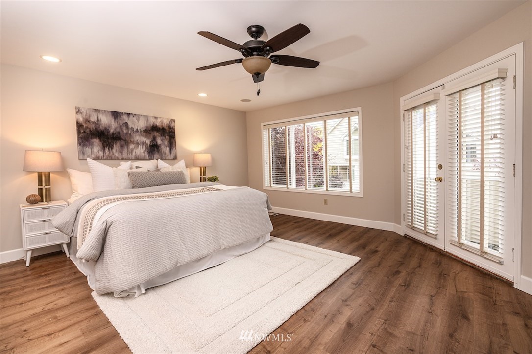 7323 Old Redmond Road, Unit 6 Redmond, WA 98052 - Photo 10 of 18 a bedroom with a large bed and a large window