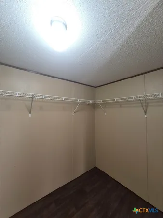 a view of a room with racks on the wall