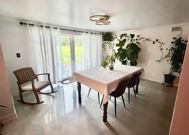 a view of a livingroom with furniture and window
