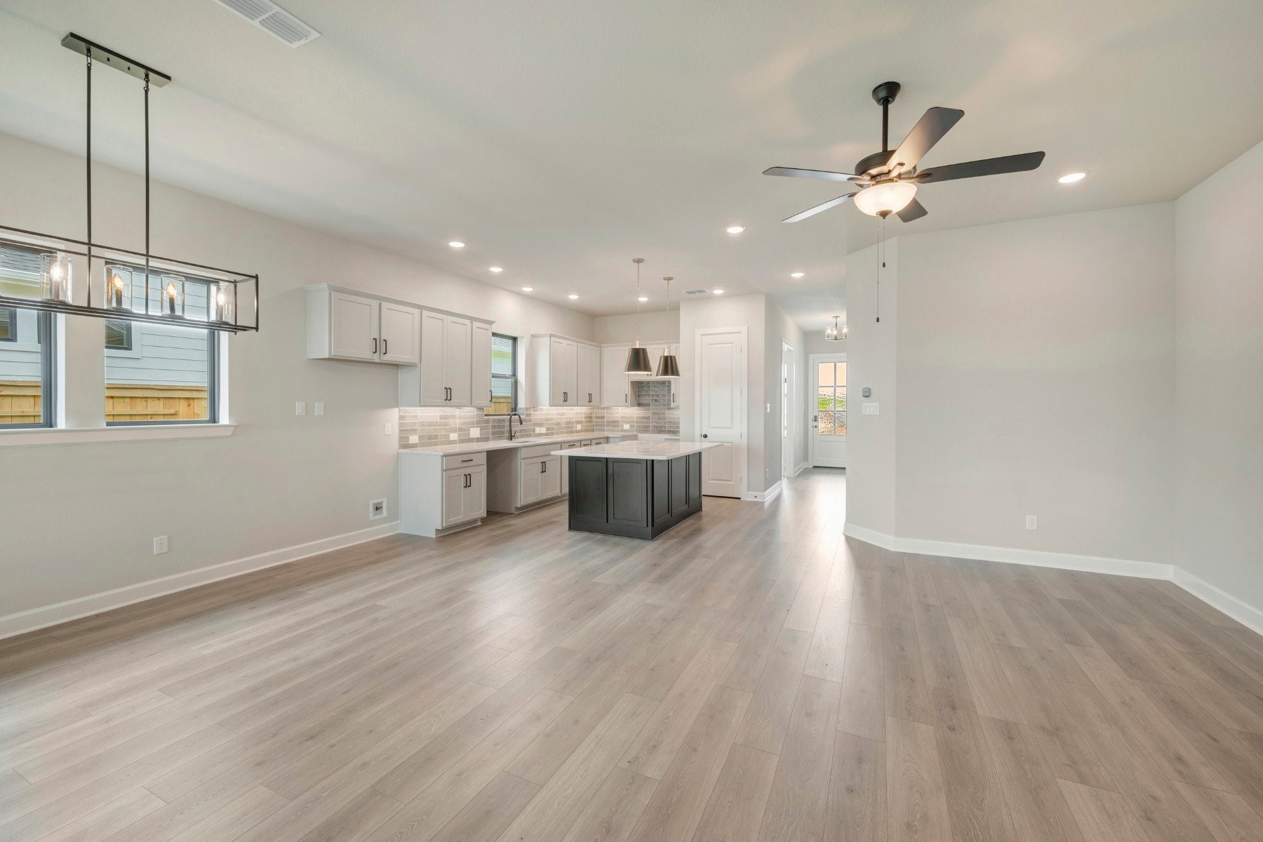 2722 Cottage Place Rosharon, TX 77583 - Photo 33 of 50 a view of a kitchen with wooden floor a sink and a window