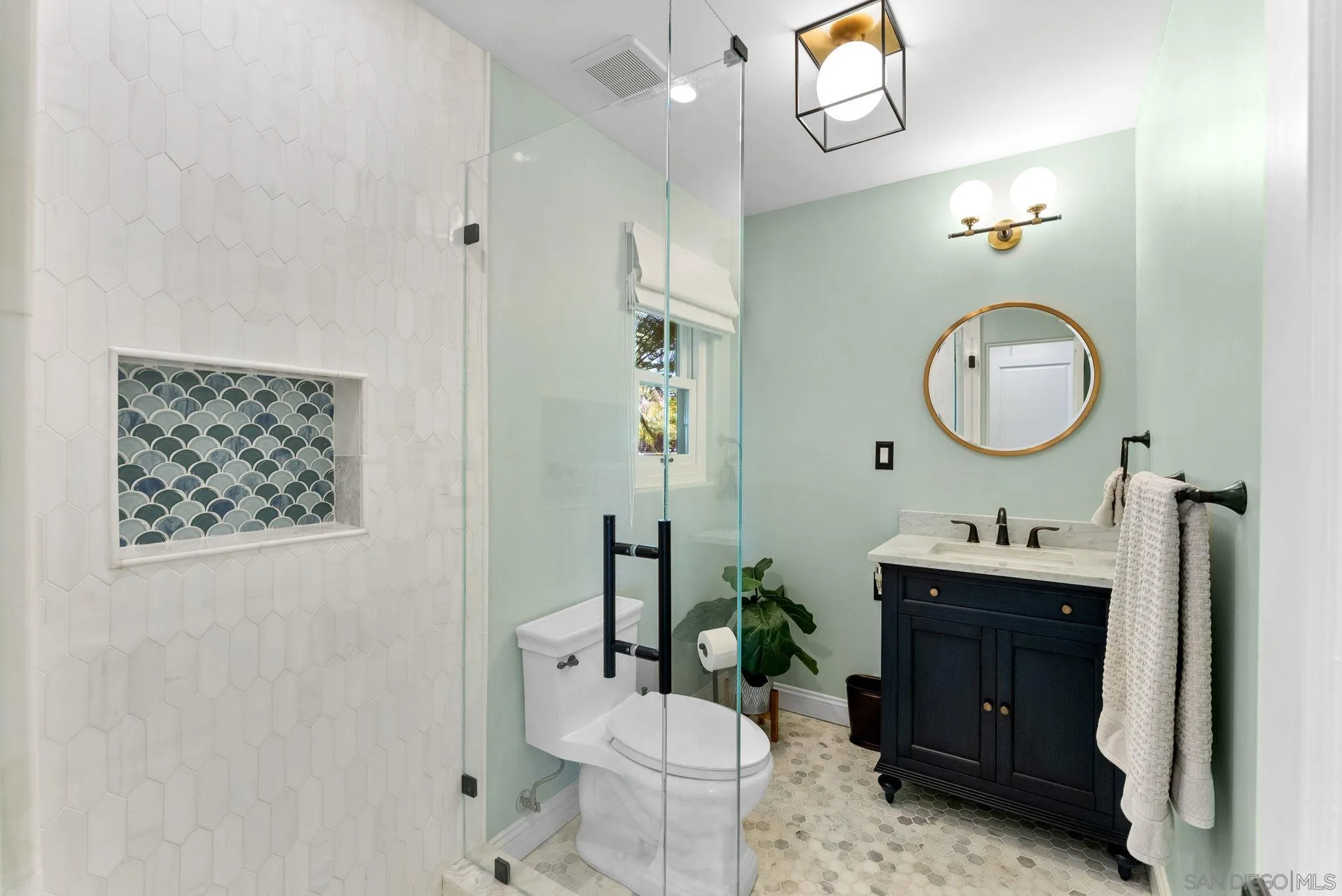 4136 Palisades Road San Diego, CA 92116 - Photo 26 of 68 a bathroom with a toilet a sink and a mirror