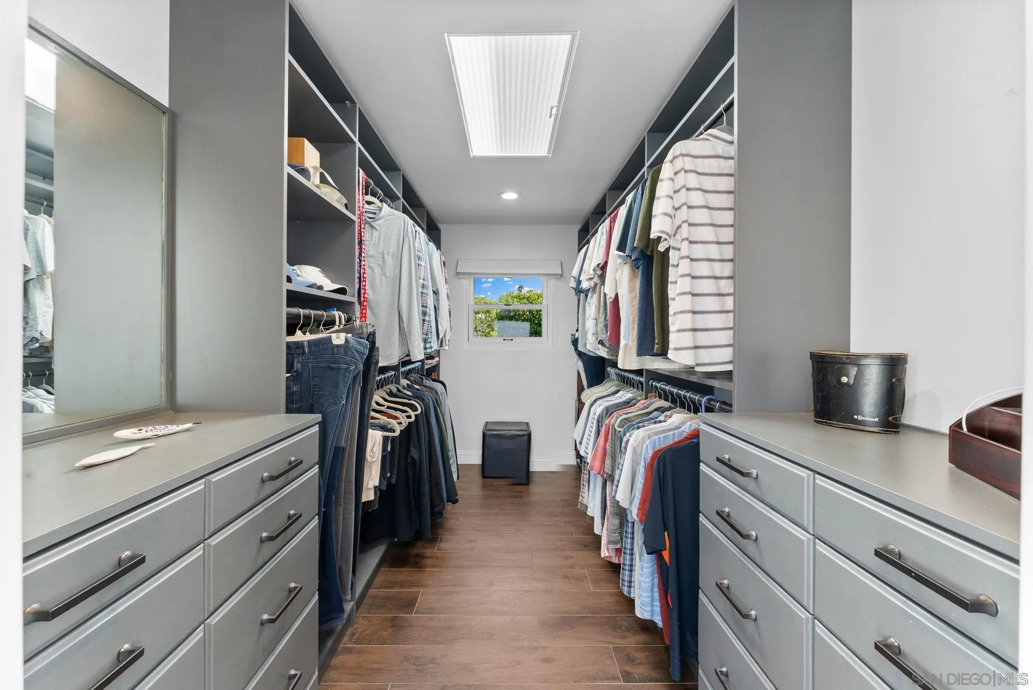 4136 Palisades Road San Diego, CA 92116 - Photo 34 of 68 a view of walk in closet with clothes and shoes