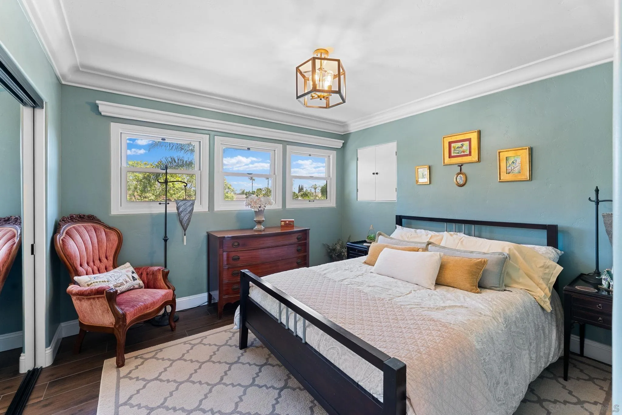 4136 Palisades Road San Diego, CA 92116 - Photo 38 of 68 a bedroom with a bed and a chandelier