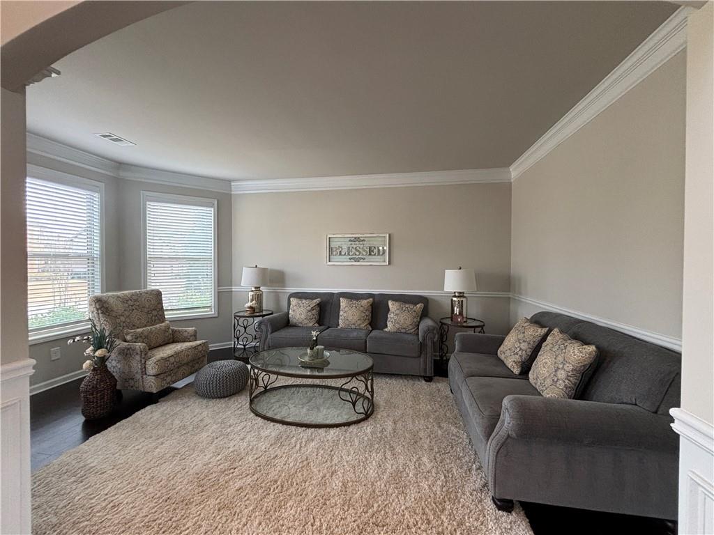 3459 In Bloom Way Auburn, GA 30011 - Photo 6 of 35 a living room with furniture a couch and a window