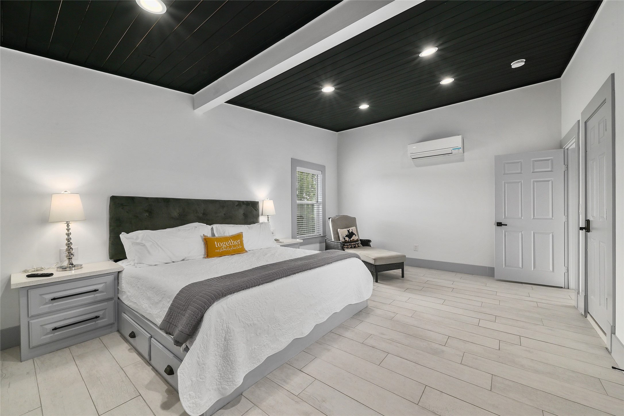 2903 Oak Ridge Drive Spicewood, TX 78669 - Photo 12 of 33 Main House Bedroom featuring light wood-style flooring, recessed lighting, and a wooden ceiling with exposed beams