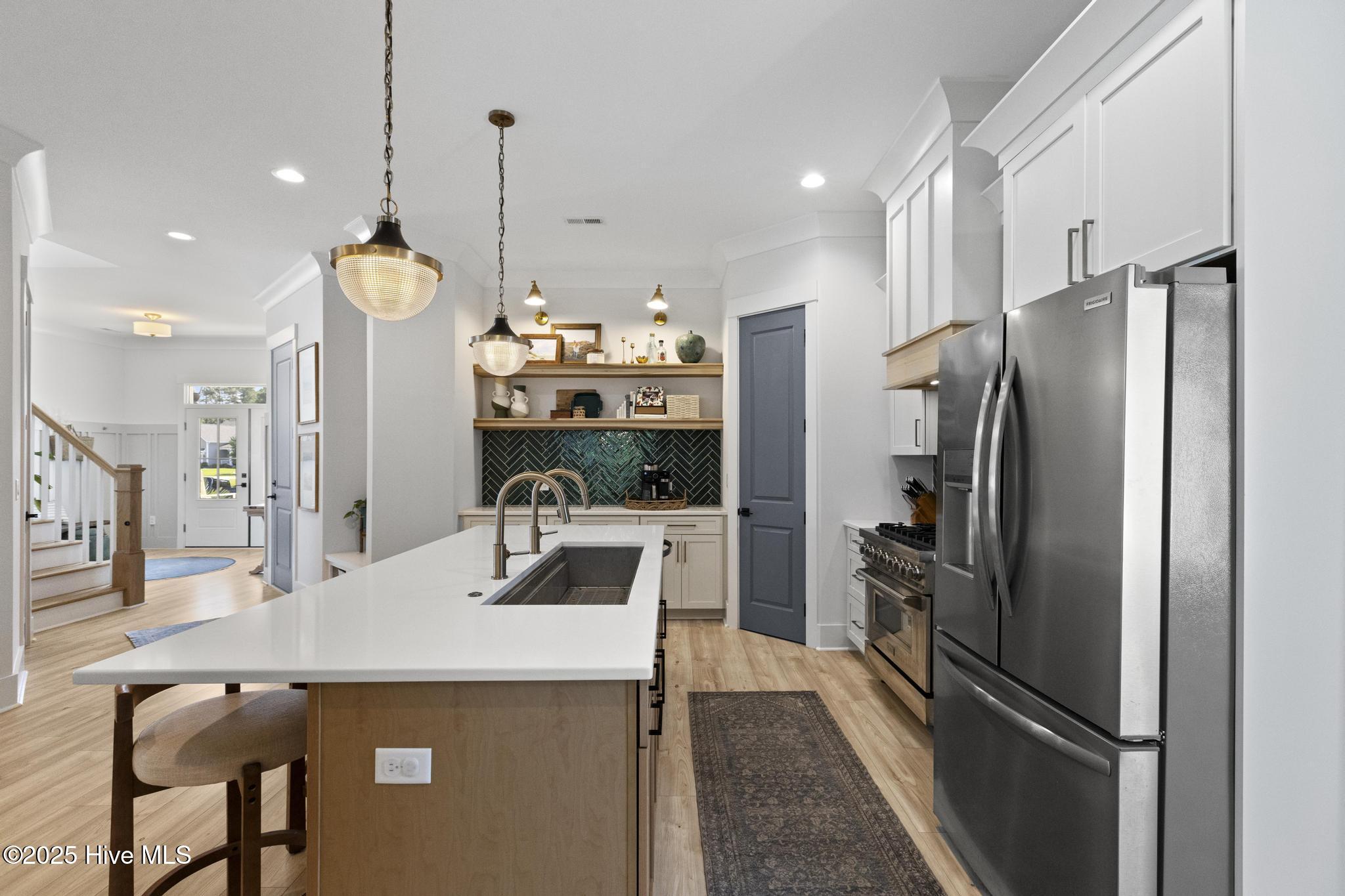 510 White Picket Way Holly Ridge, NC 28445 - Photo 20 of 63 Dual-Fuel Z-Line Range, 5 ft kitchen sink (dual faucet), poplar floating shelves, wood-shelved pantry