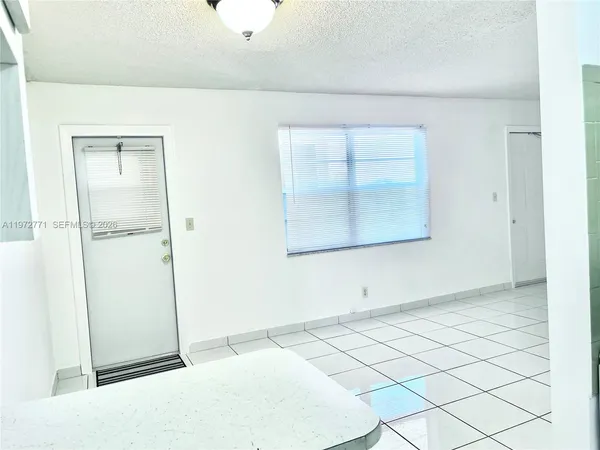 a view of an empty room with window