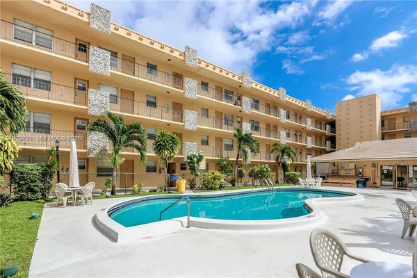 a view of a swimming pool with a patio