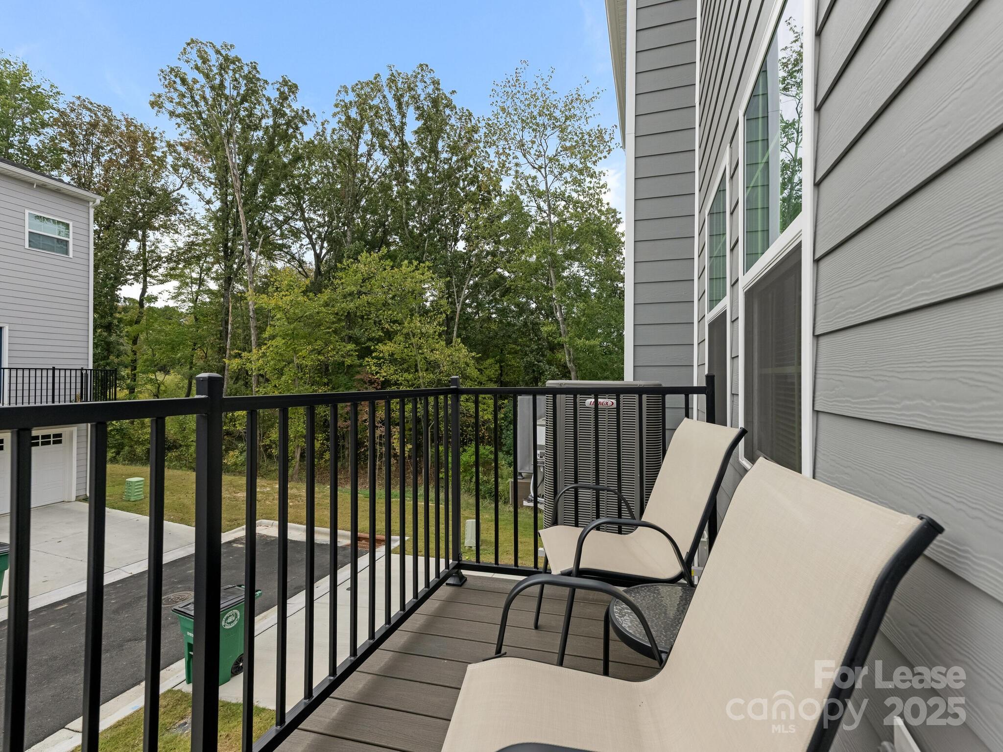 1409 May Apple Drive Matthews, NC 28104 - Photo 15 of 28 a view of a balcony with wooden floor and fence