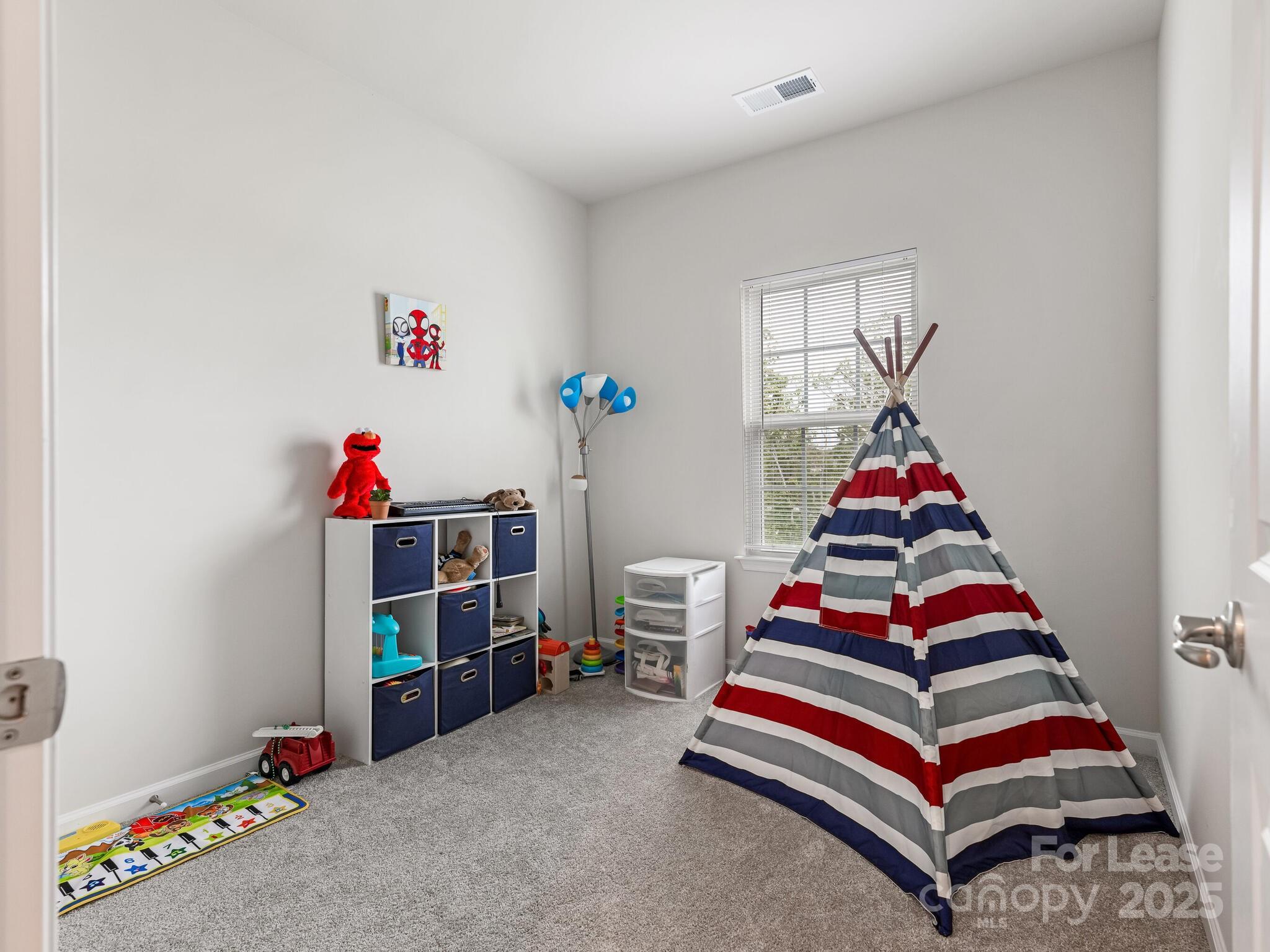 1409 May Apple Drive Matthews, NC 28104 - Photo 21 of 28 a bedroom with stairs and a couch