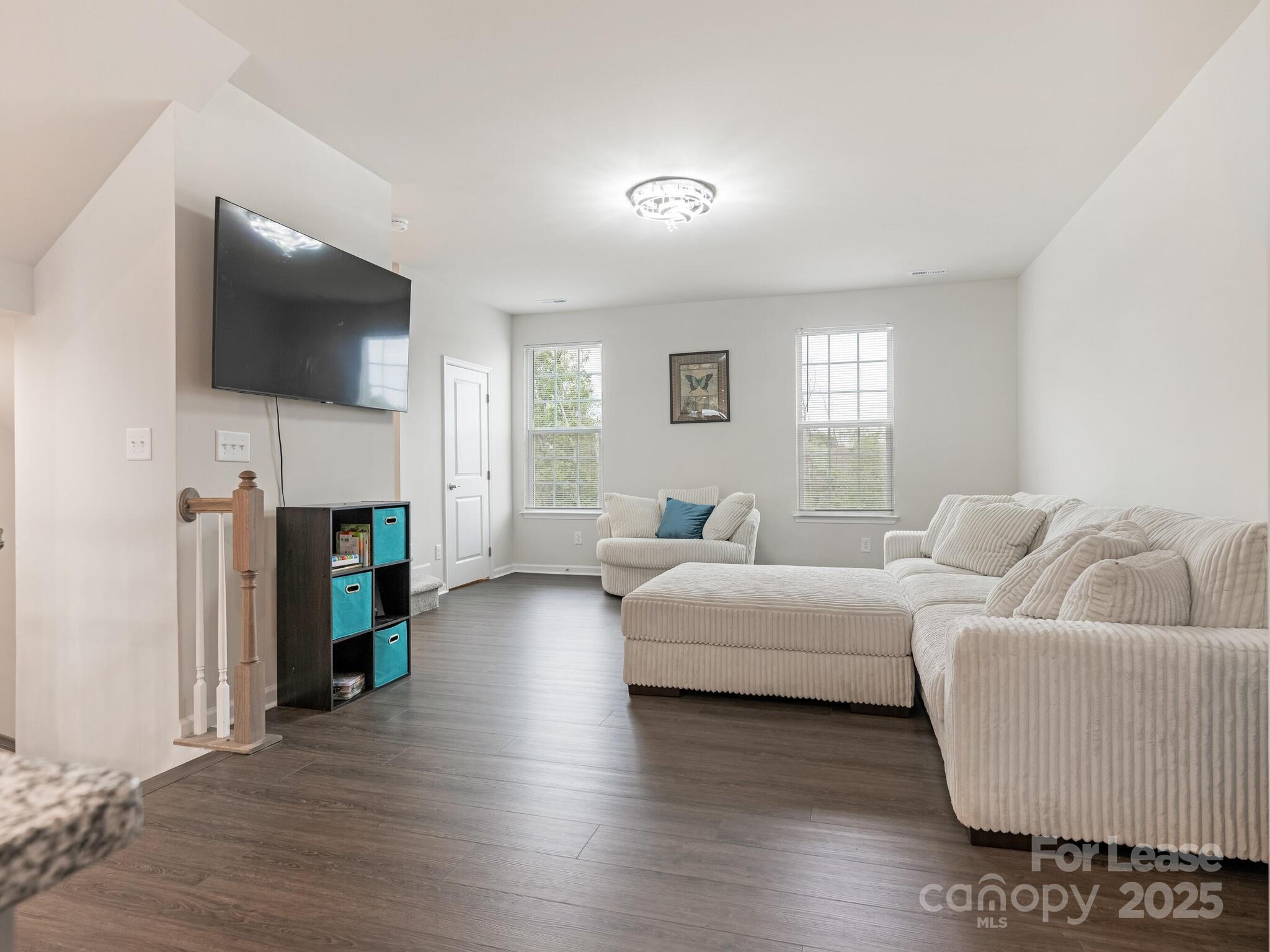1409 May Apple Drive Matthews, NC 28104 - Photo 7 of 28 a living room with furniture and a flat screen tv
