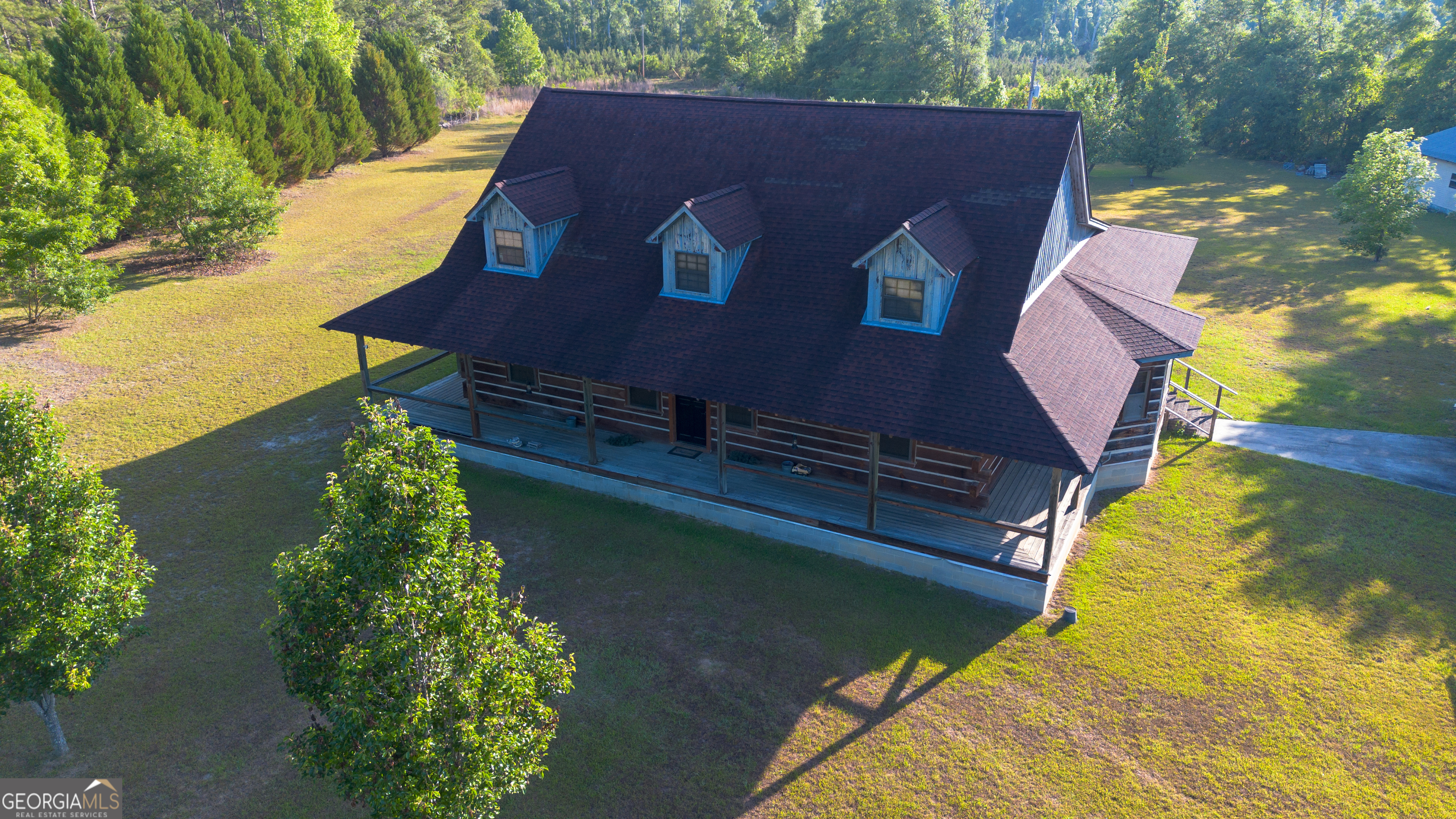 4530 Highway 301 Register, GA 30452 - Photo 19 of 19 a aerial view of a house with swimming pool and large trees