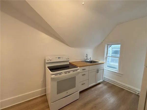 a kitchen with a stove and a microwave