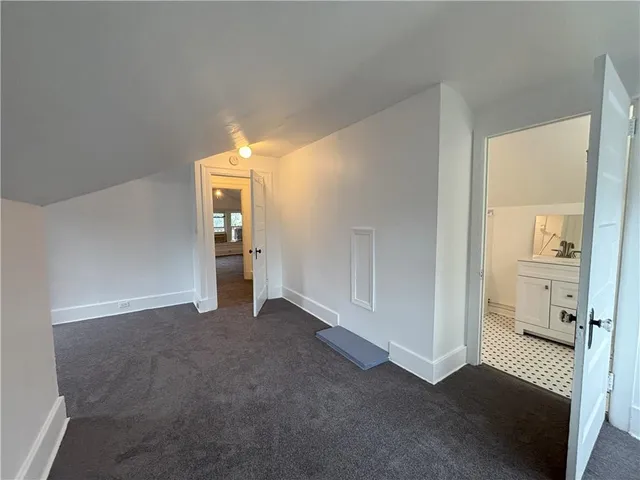 a view of a room with cabinet and mirrors