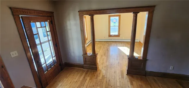 a view of an entryway with a floor to ceiling window