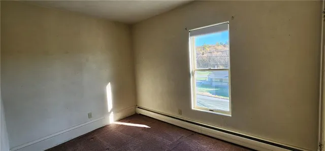 a view of an empty room and window