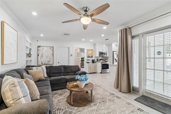 a kitchen with stainless steel appliances kitchen island granite countertop a sink and cabinets