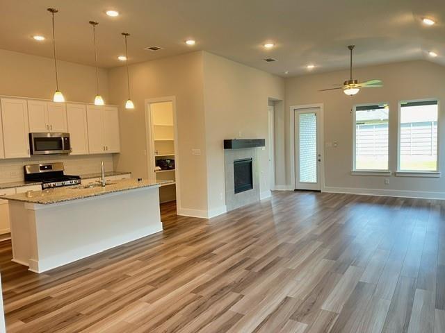 7108 Dragonfly Lane Little Elm, TX 76227 - Photo 2 of 9 a view of kitchen with sink and wooden floor