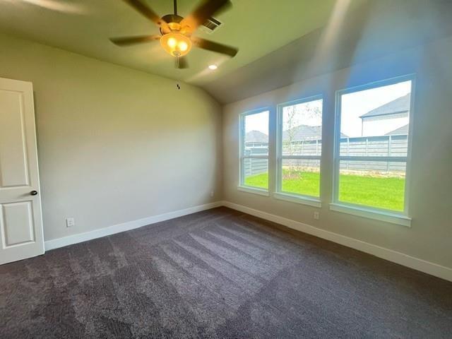7108 Dragonfly Lane Little Elm, TX 76227 - Photo 4 of 9 a view of an empty room and window and chandelier fan