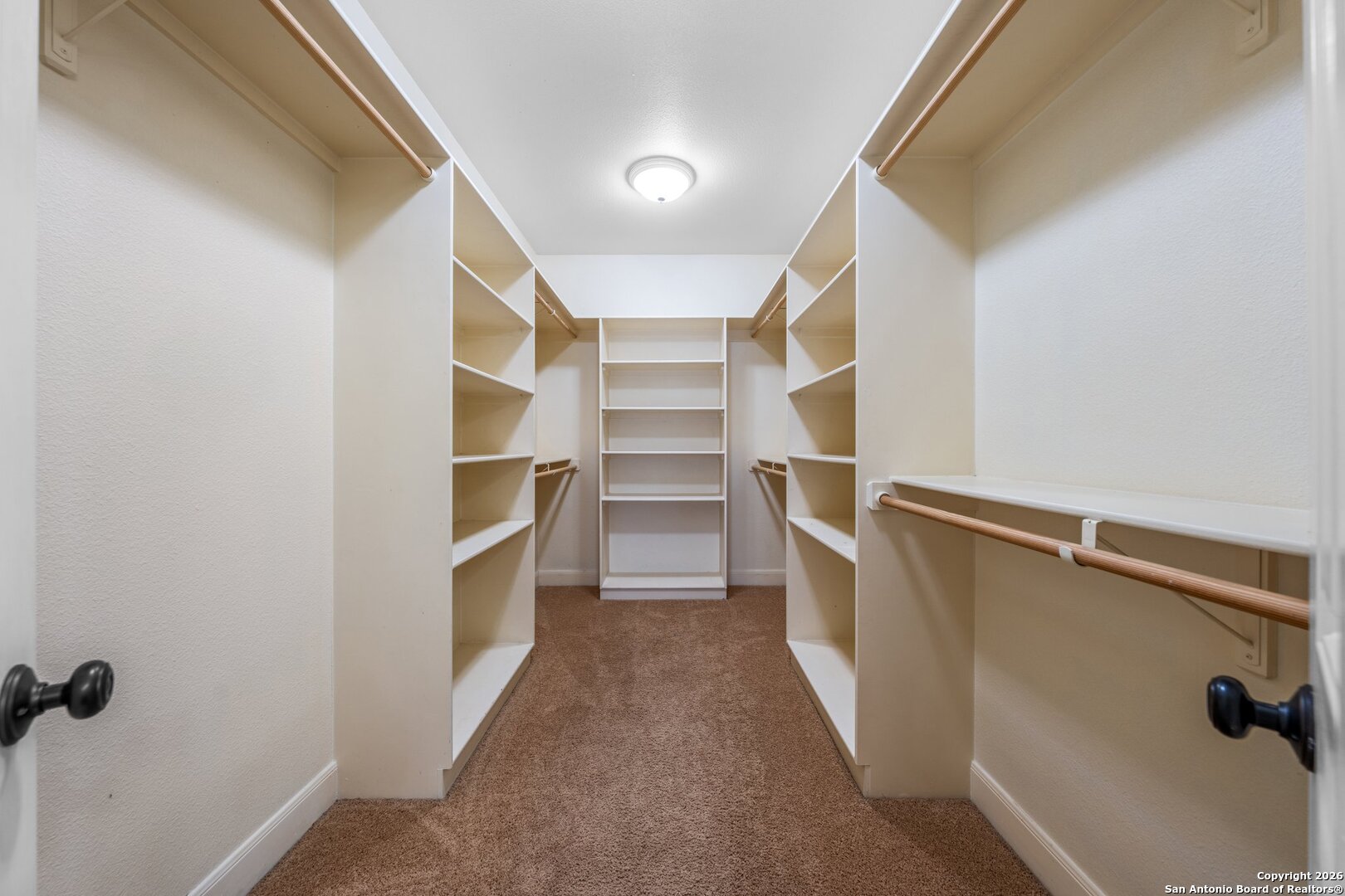 130 Rhum Road Kerrville, TX 78028 - Photo 12 of 31 a view of walk in closet with empty racks