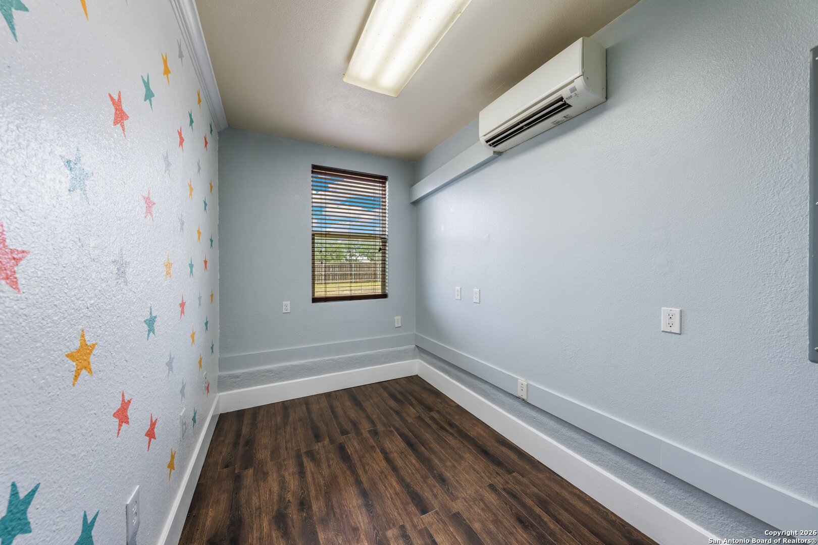 130 Rhum Road Kerrville, TX 78028 - Photo 19 of 31 a view of a hallway with wooden floor and a bathroom