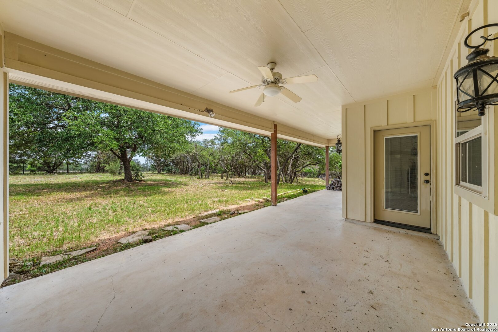 130 Rhum Road Kerrville, TX 78028 - Photo 24 of 31 a view of an empty room with a large window and kitchen view